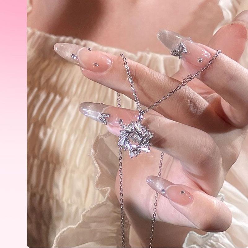Product Introduction of Silver Titanium Steel Cross Chain Necklace with Winter Beating Heart Snowflake Pendant for Women Sweet Light Luxury Clavicle Chain 9