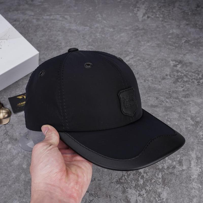 Mũ nón kết sơn da bò có gắn logo da mặt trước vải dù gió hai lớp