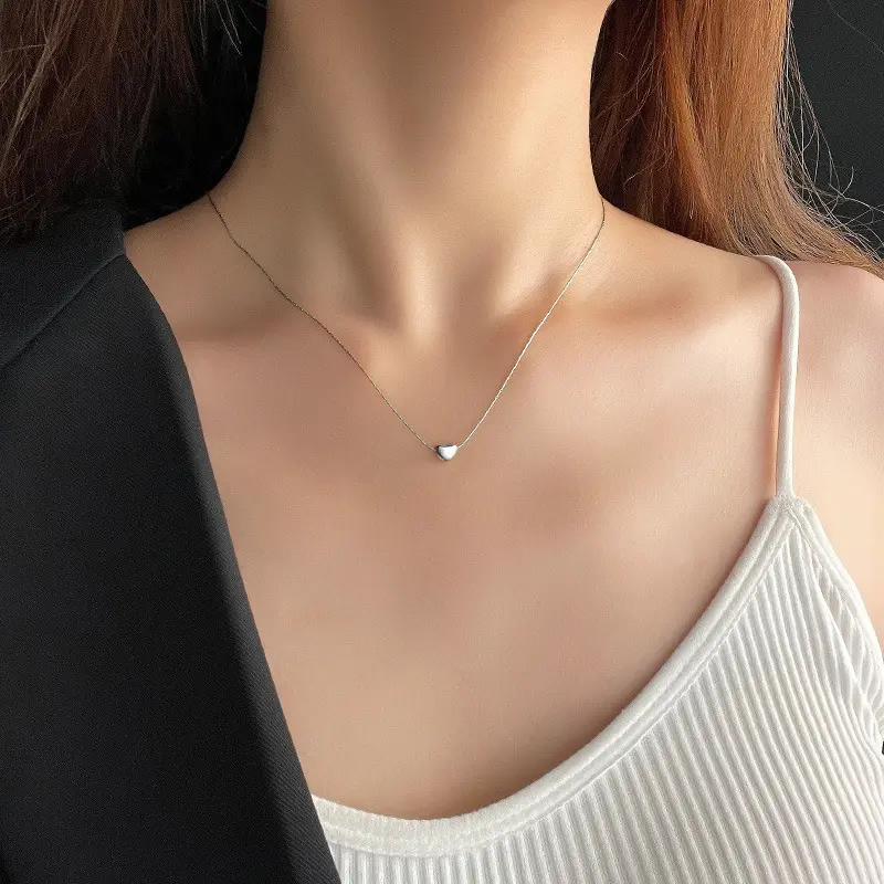 Must-buy! The Non-fading Titanium Steel Heart-shaped Necklace. With a Simple Perforation Design, the Small Heart and Gold-plated Accessory Show Ladies' Graceful Temperament.
