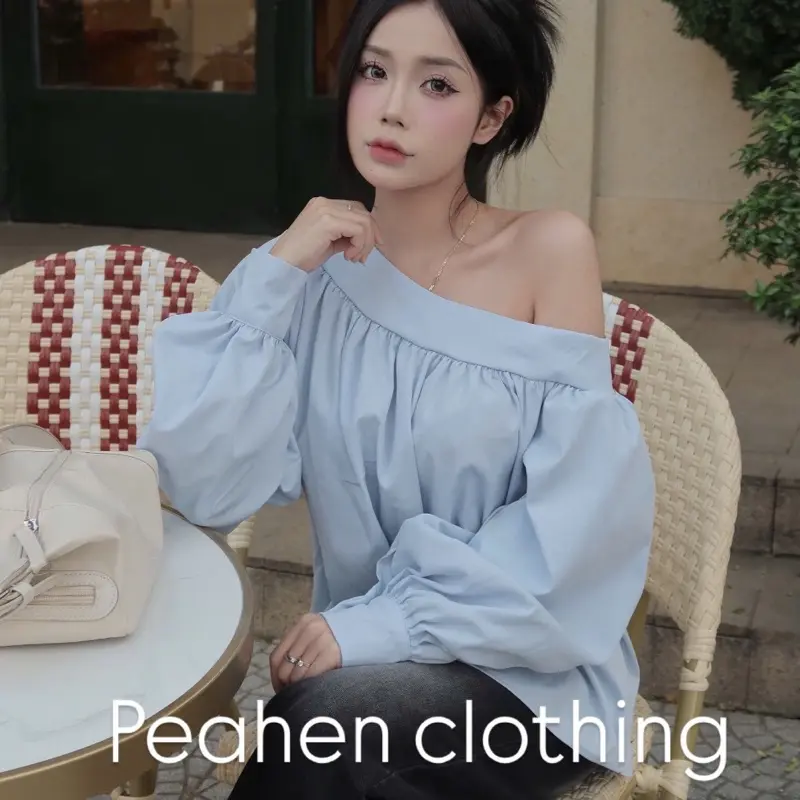 Peahen clothing - Áo sơ mi lệch vai nữ dáng xuông bo tay chất thô mềm