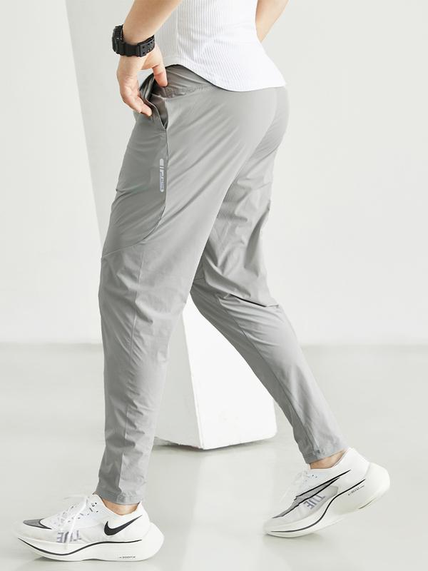 Quần thể thao nam dáng dài mùa đông vải gió co giãn thoải mái, kiểu dáng trẻ trung năng động QGD Menswear Pants