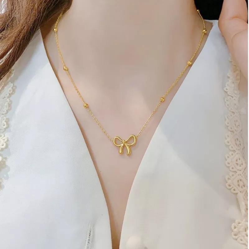  Dây chuyền sợi mảnh hạt bi. Mặt nơ có kích thước ngang 16mm. Titan 18k. không đen hoen gỉ tiếp xúc nước thoải mái. không gây dị ứng da bền màu 1- 2 năm . Nữ Trang Sức 