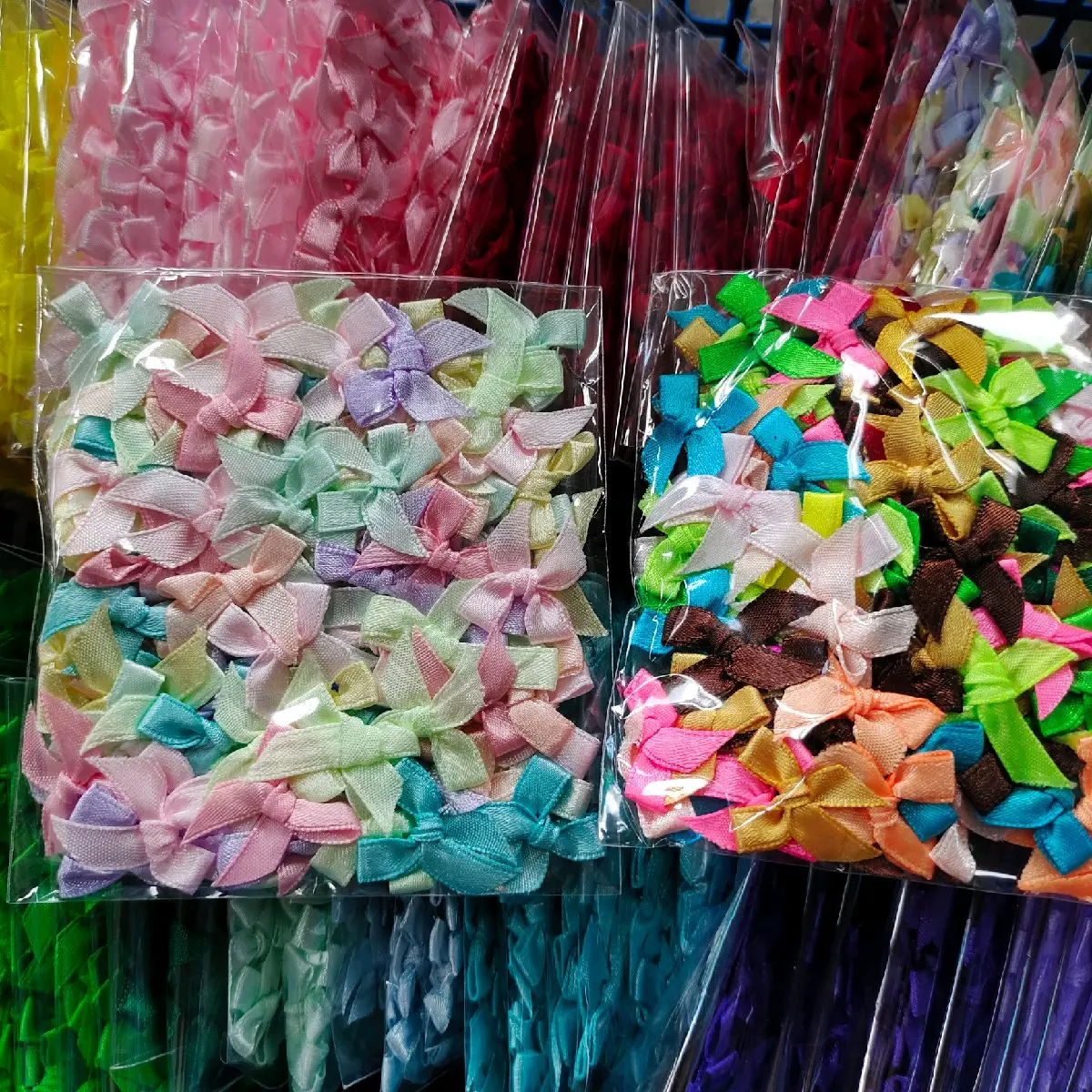 โบว์จิ๋ว ห่อละ100 ชิ้น สีล้วน/คละสี