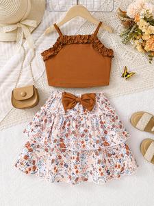 Conjunto de dos piezas para niña con top corto camisola liso y falda con decoración de moño y estampado floral, top sin mangas casual y falda en línea A para uso diario, ropa de verano para niños