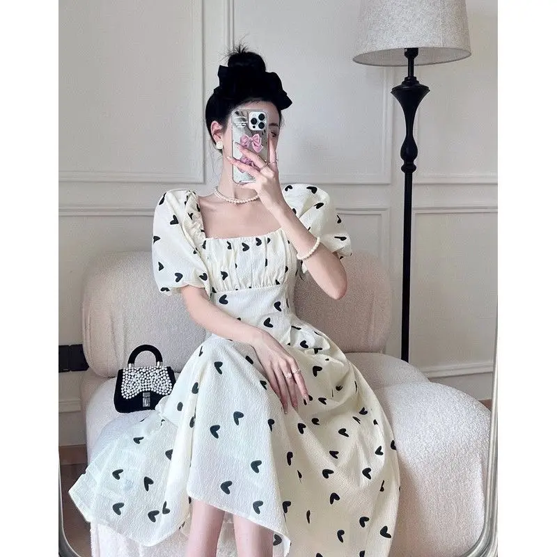 V26 Đầm trắng hoạ tiết đen dáng dài nơ lưng