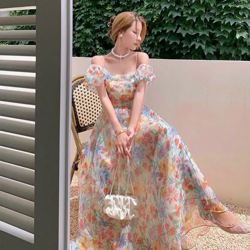 Đầm voan hoa đan dây lưng tay phồng có mút ngực cổ vuông, váy hoa maxi dài đi biển