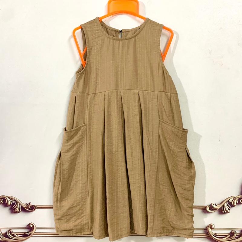 Váy bé gái 12-35kg chất đũi có hai túi to hai bên ,váy có hai màu Hồng và nâu