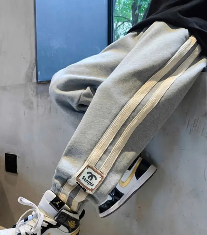 Quần Joger bé trai thu đông phối đường sọc bằng dù cao cấp cho bé tư 19-47kg mặc vừa, chất nỉ da cá tàu dày dặn đường may kĩ. Bim Xoài KIDS 2