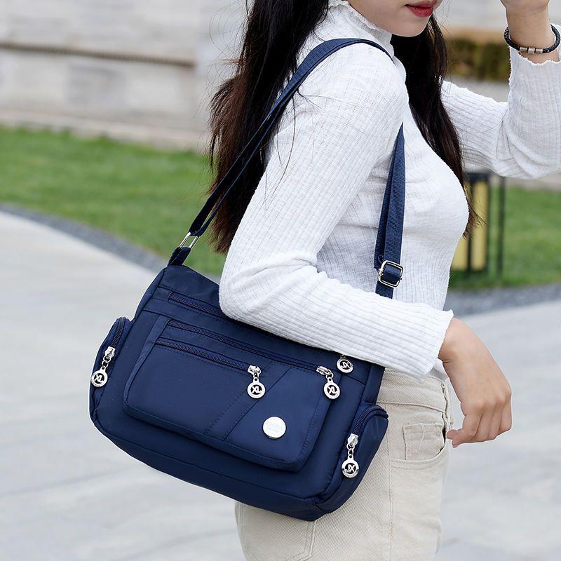 Product Introduction of Women's Bag Mother's Bag New 2025 Middle-Aged Women's Bag Nylon Canvas Bag Waterproof Multi-Layer Shoulder Messenger Bag 14