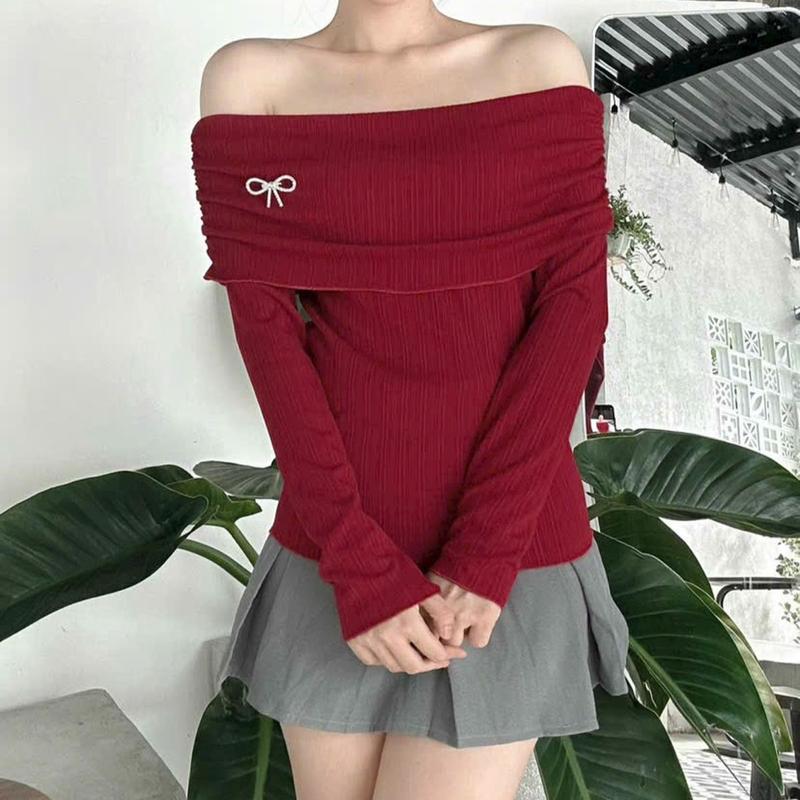 Áo trễ vai đính nơ chất thun gân tăm