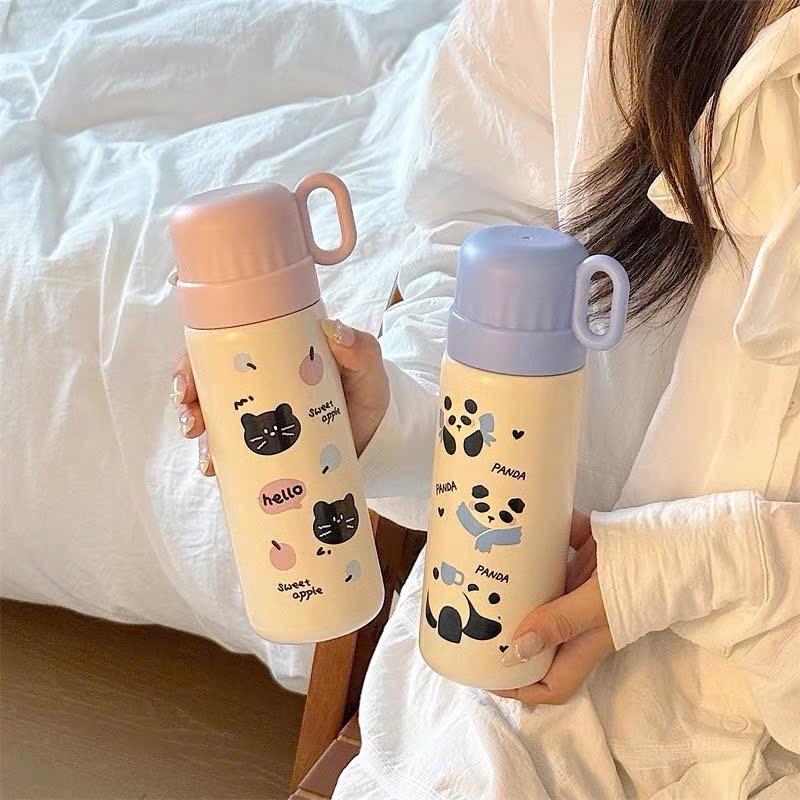 Bình Nước Giữ Nhiệt Hình Nơ - Mèo Có Kèm Cốc Uống Nước Dung Tích 500ml Tặng kèm túi trong A.T