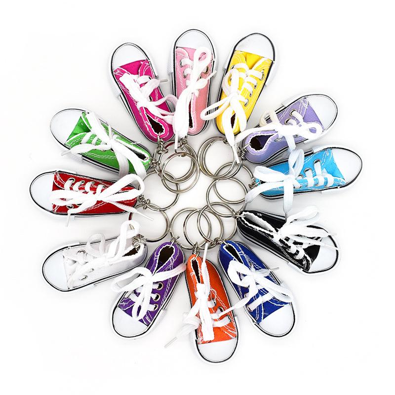 Product Introduction of Motorcycle Bicycle Foot Support Mini Cute Shoes Creative Car Keychains for Motorbike Bike Tripod Canvas Shoes Decor Cover 6