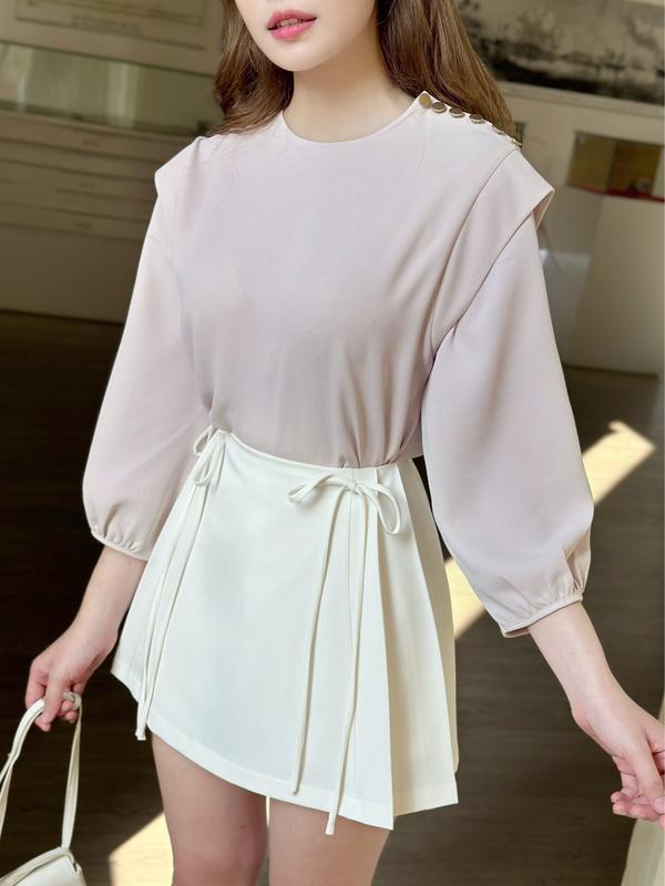 Chân váy chữ A trắng ngắn ODS thiết kế quần trong, xếp ly dọc 2 bên, nơ eo, dây kéo sau trẻ trung, năng động - DD11