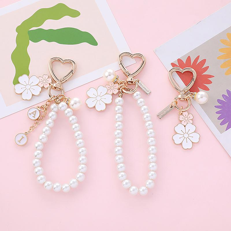 Dây Chuyền Chìa Khóa Hoa Anh Đào Màu Hồng Ngọt Ngào Mặt Dây Chuyền Điện Thoại Hình Thỏ, Móc Chìa Khóa Xe Hơi Chữ Cái, Vỏ Tai Nghe Phụ Kiện Trang Trí Túi 1