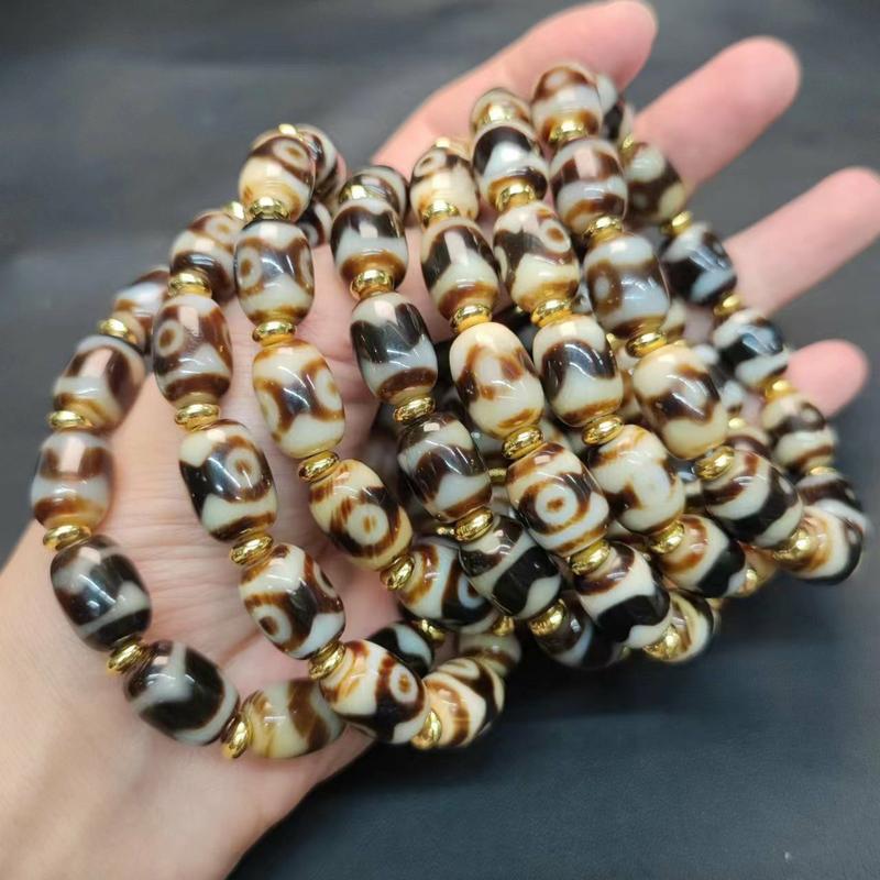 Product Introduction of Natural Gemstone Tiger Tooth Pattern Panda Mandala Three-Eyed Agate Dzi Bead Multi-Treasure Bracelet Tooth Yellow White Core Barrel Bead Unisex Ethnic Style 3