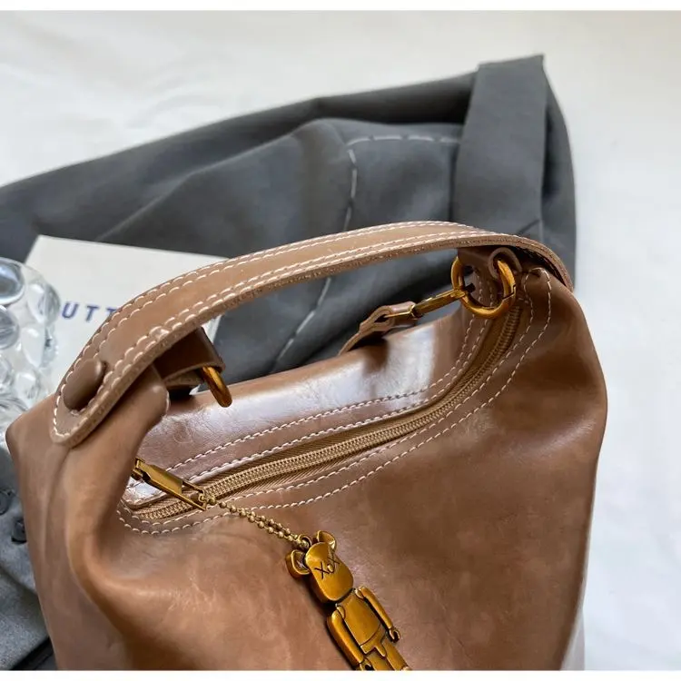 Túi da nâu ánh hồng da mềm đanh kèm khóa gấu kim loại dáng giọt nước Bag Nữ Kem 6