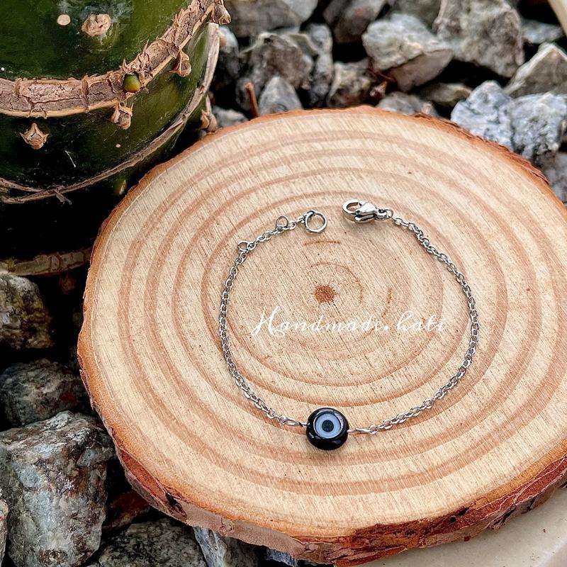  Vòng tay mắt quỷ evil eye thép titan không gỉ không đen phối 2 mắt 