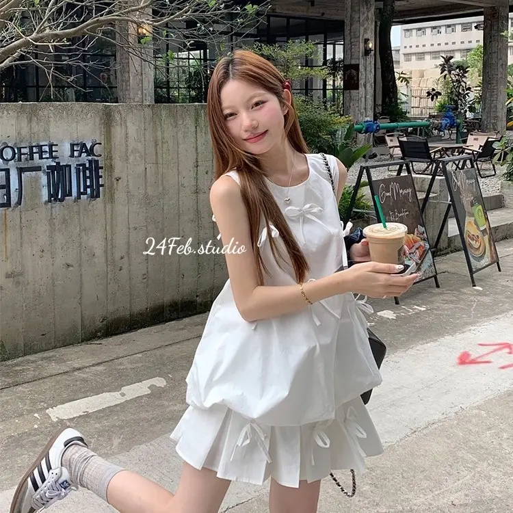 [SET55] Set áo ba lỗ kèm chân váy xếp li dáng ngắn đính nơ phong cách tiểu thư Hàn Quốc 4