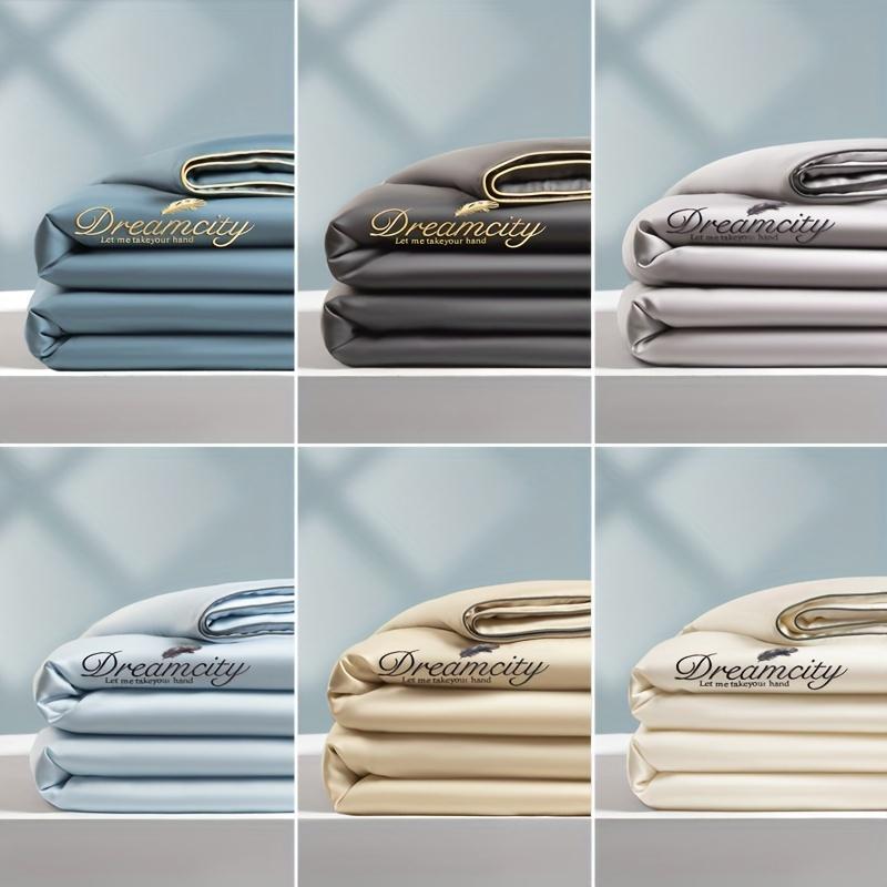 Product Introduction of 1 Piece Dreamy Summer Light Quilt - Soft, Light Beige Friendly 100% Microfiber, Designed with Gold Leaves and "DREAMCITY" Words, Gray with Gold Accents, Machine Washable, Pillowcase and Bed Sheet Not Included, Summer Bedding | Fantasy-themed Decoration | 3