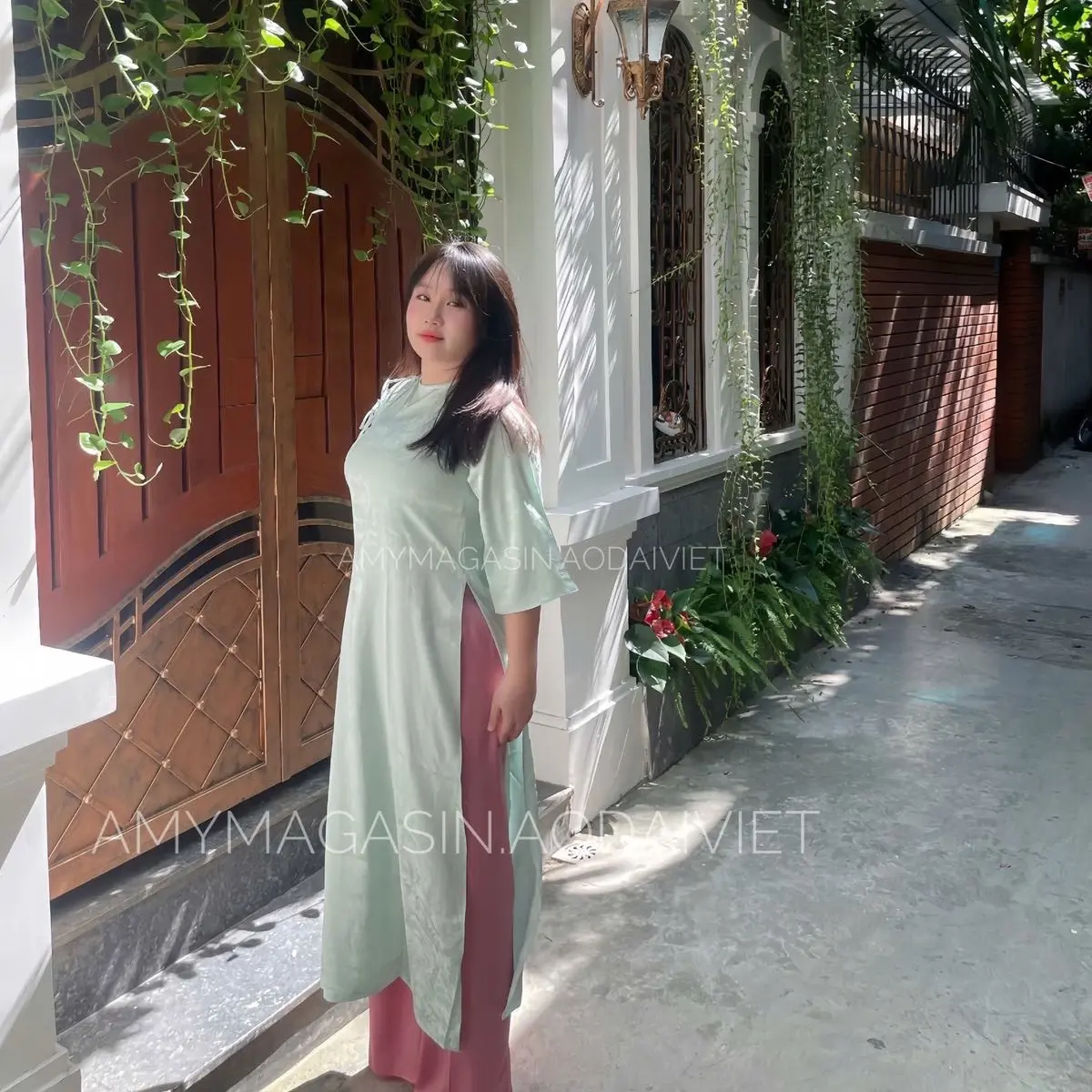 Áo dài gấm Liên Hoa xanh ngọc
