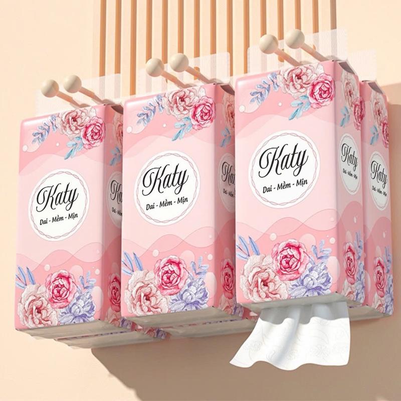 thùng 10 bịch tặng kèm 2 bịch và 4 móc treo giấy treo đa năng  katy hoa hồng , khăn rút treo tường 4 lớp mỗi bịch 1100 tờ dai mềm từ bột tre . Giấy vệ sinh