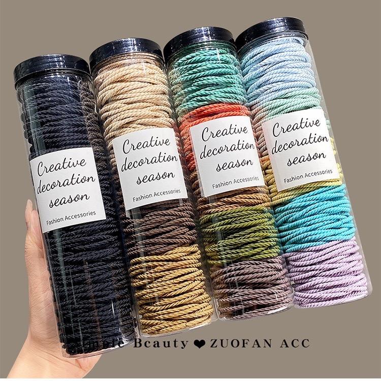  ￼Hộp 100 chiếc dây buộc tóc cao su độ đàn hồi tốt chun cột tóc cho nữ và bé gái nhiều màu sắc 