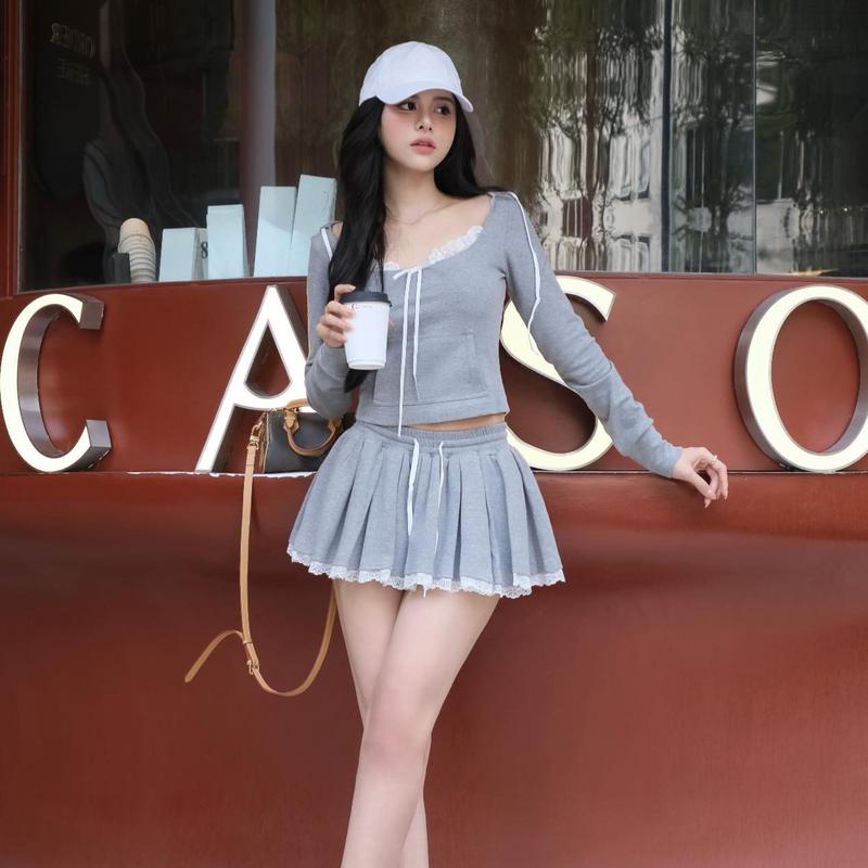 M931 - Set áo thun croptop tay dài phối ren nơ kèm chân váy ngắn xòe