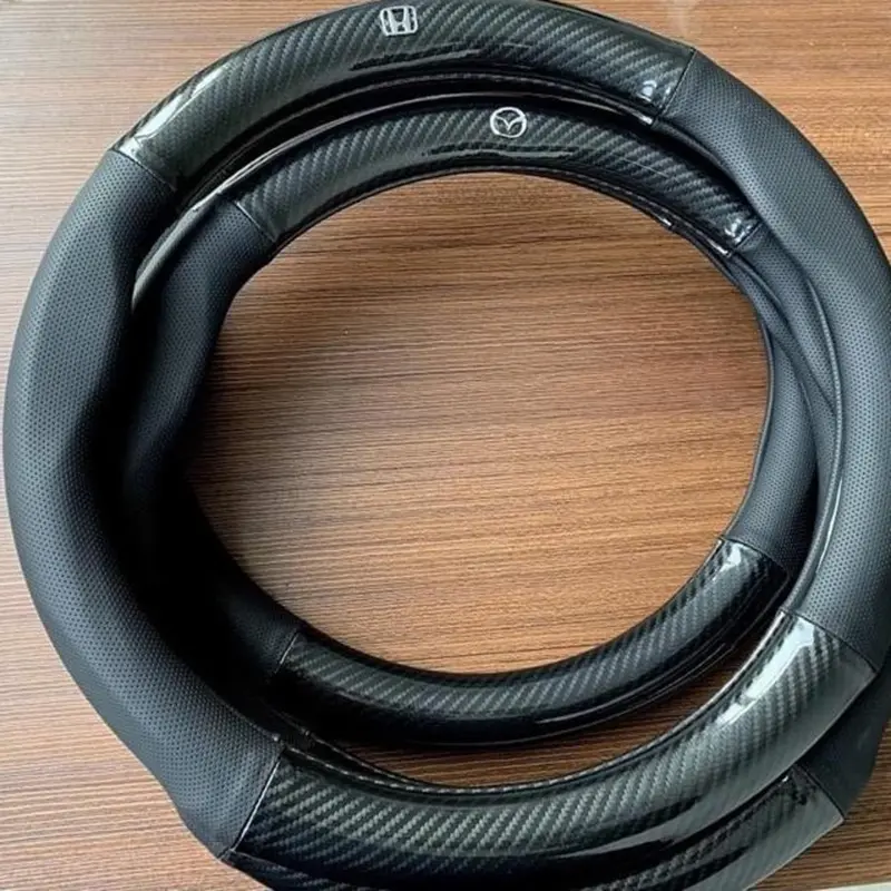 Bọc vô lăng CARBON phối da thoáng khí đủ các hãng xe Toyota-Honda-Hyundai-Mazda-KiA-Ford-Mitshubishi-Chevrolet cao cấp Cacbon 3