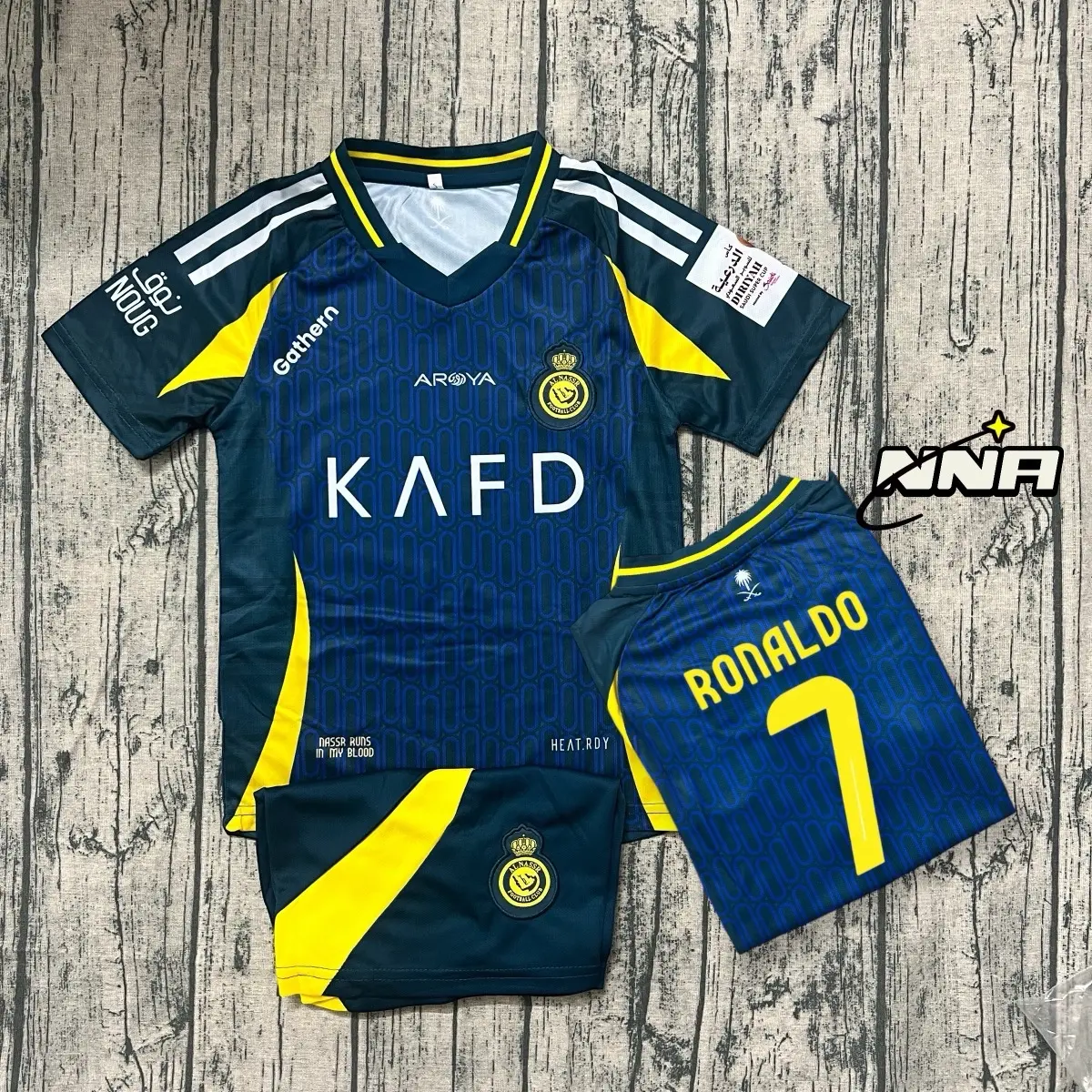 Quần áo bóng đá trẻ em, Áo đá Banh cho Bé CLB Alnassr in sẵn Cr7 Vải Mè Thái