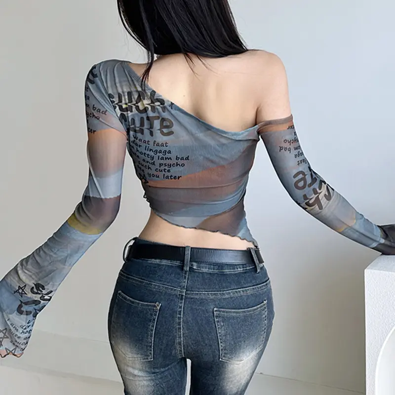 [HEYSOUL] Crop Top Asimetris Transparan One Shoulder Gaya Korea Y2K Atasan Cewek Kekinian Bahan Mesh Motif Tulisan Aesthetic Edgy Outfit OOTD Streetwear Korean Look Baju Wanita Muda Fashion Stylish Tampil Beda Buat Nongkrong atau Hangout Casual Basic Unik 1