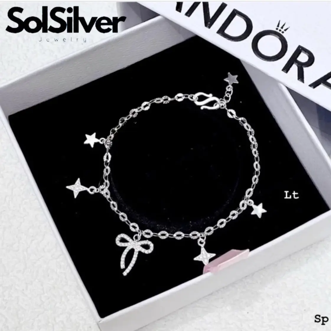 Lắc tay charm nơ kiểu mảnh dài Sol Silver