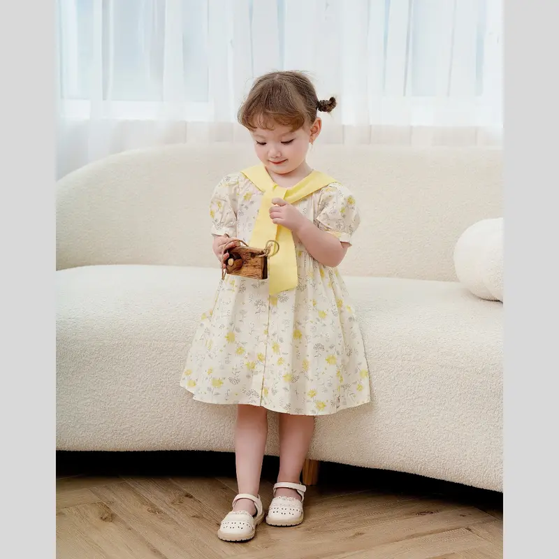 Váy bé gái tay bồng chất thô cotton họa tiết hoa phối dây vàng 1