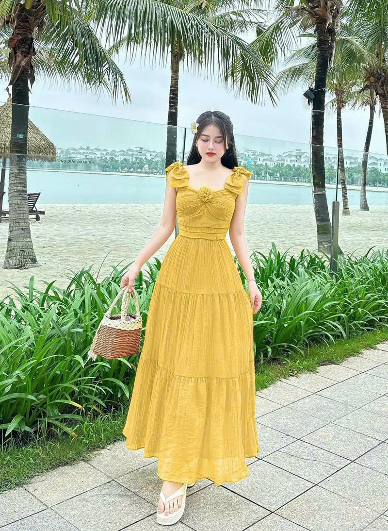 Product Introduction of Đầm maxi thời trang nữ mặc đi biển chất tăm gãy vai nơ ngực gắn bông váy dài xòe maxi có lót trong có 5 màu như hình qc Màu Hồng 3
