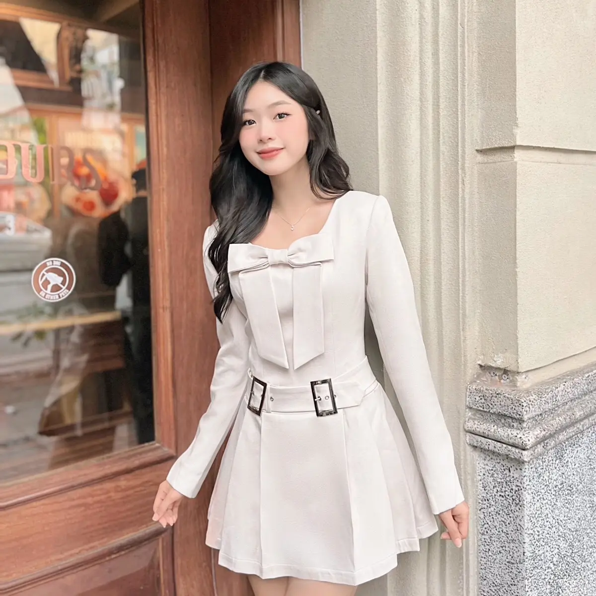 Váy xòe xếp ly gắn nơ kèm thắt lưng Vella Beige Dress