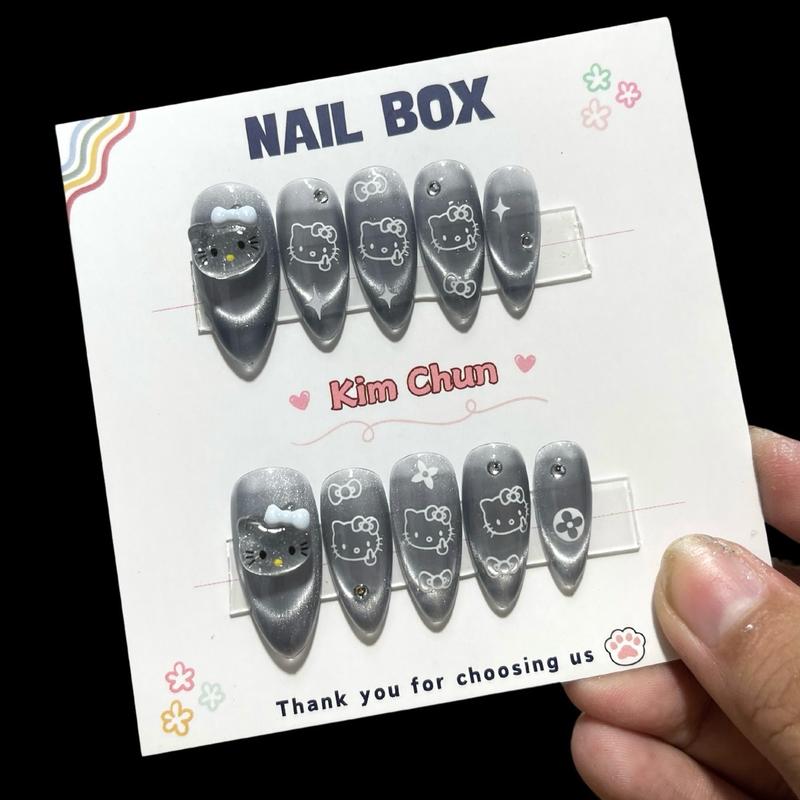 C103: Nailbox charm nổi Hello Kitty mắt mèo đen form tròn nhọn