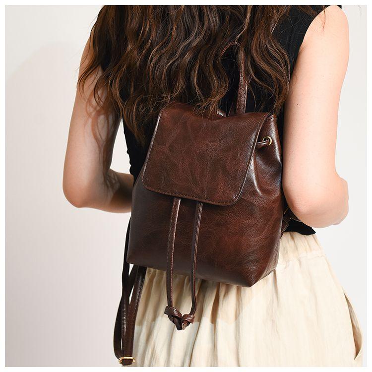 Product Introduction of Beg galas berbilang belakang coklat retro untuk wanita, beg bahu bertali, ringkas dan serba guna, gaya seni, baharu PU Leather Canvas Plain Floral Striped Polka Dot Black Brown Navy PU Leather Backpack Ransel Bags 10
