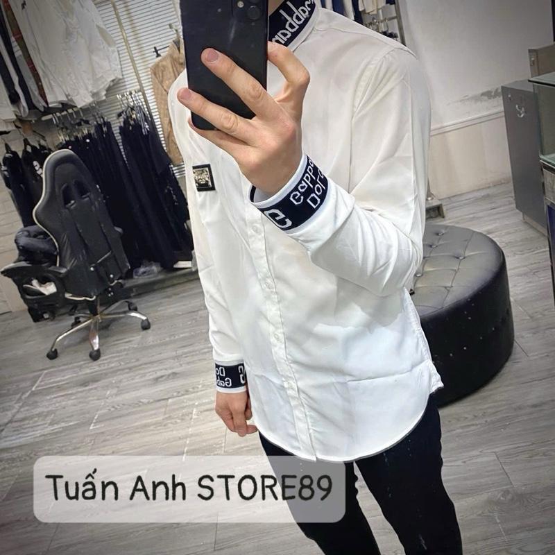 Áo sơ mi trắng dài tay nam nữ TA DÊ VÀ GÀ trơn phối bo cổ và tay chun dệt chữ sọc viền trắng trước ngực thêu da tag kim loại SM142