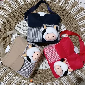 Tas bayi kecil boneka sapi